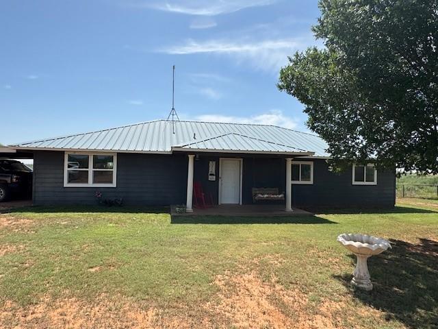 372 County Road 107 Roby, TX 79543 - Photo 1 of 1 a front view of a house with a yard and garage