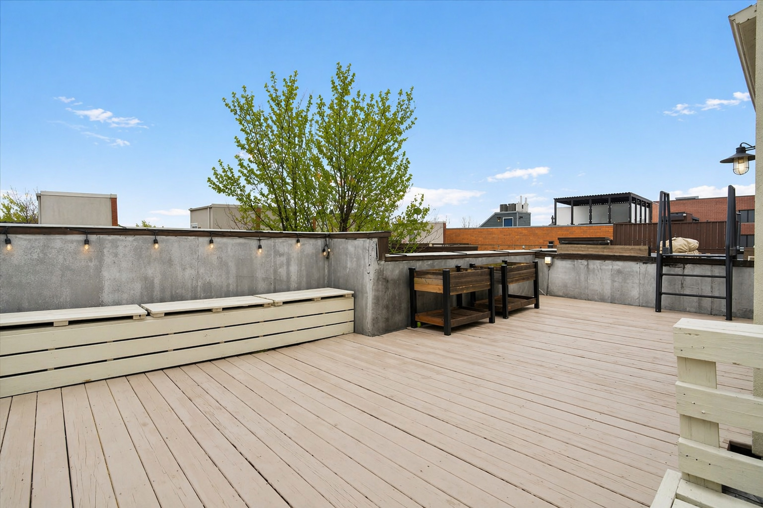 1012 South Loomis Street, Unit D Chicago, IL 60607 - Photo 16 of 17 a view of a terrace with outdoor seating and city view