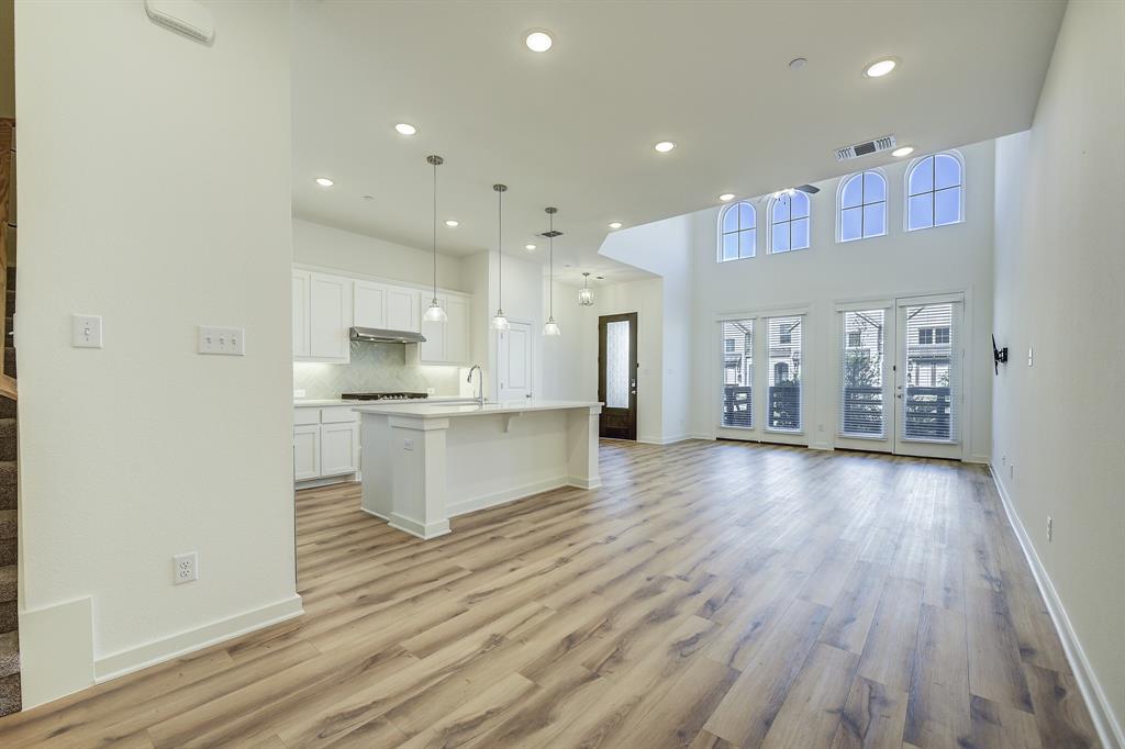 3708 Queen Road Sherman, TX 75090 - Photo 14 of 40 a view of kitchen with kitchen island wooden floors and center island
