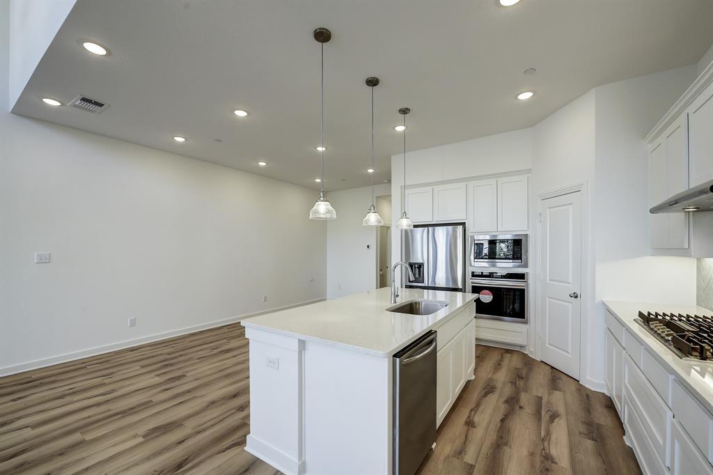 3708 Queen Road Sherman, TX 75090 - Photo 21 of 40 a kitchen with a sink stove and refrigerator
