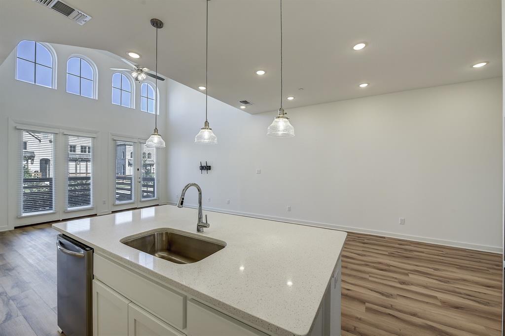 3708 Queen Road Sherman, TX 75090 - Photo 23 of 40 a kitchen with granite countertop a sink a counter space and cabinets