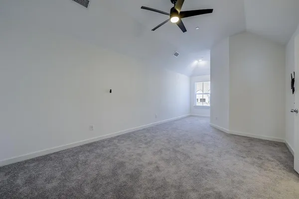 a view of a room with window and ceiling fan view