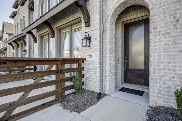 a view of a door of the house with a street
