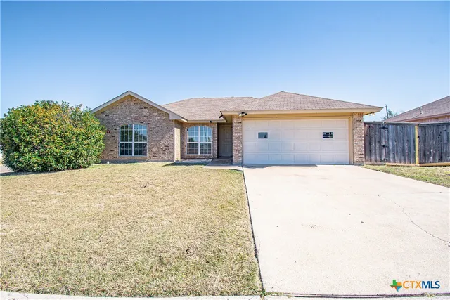 a front view of a house with a outdoor space