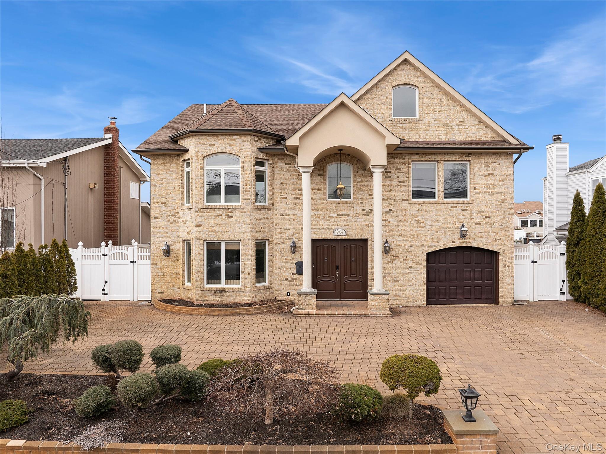 2904 Riverside Drive Wantagh, NY 11793 - Photo 1 of 19 a front view of a house with a yard