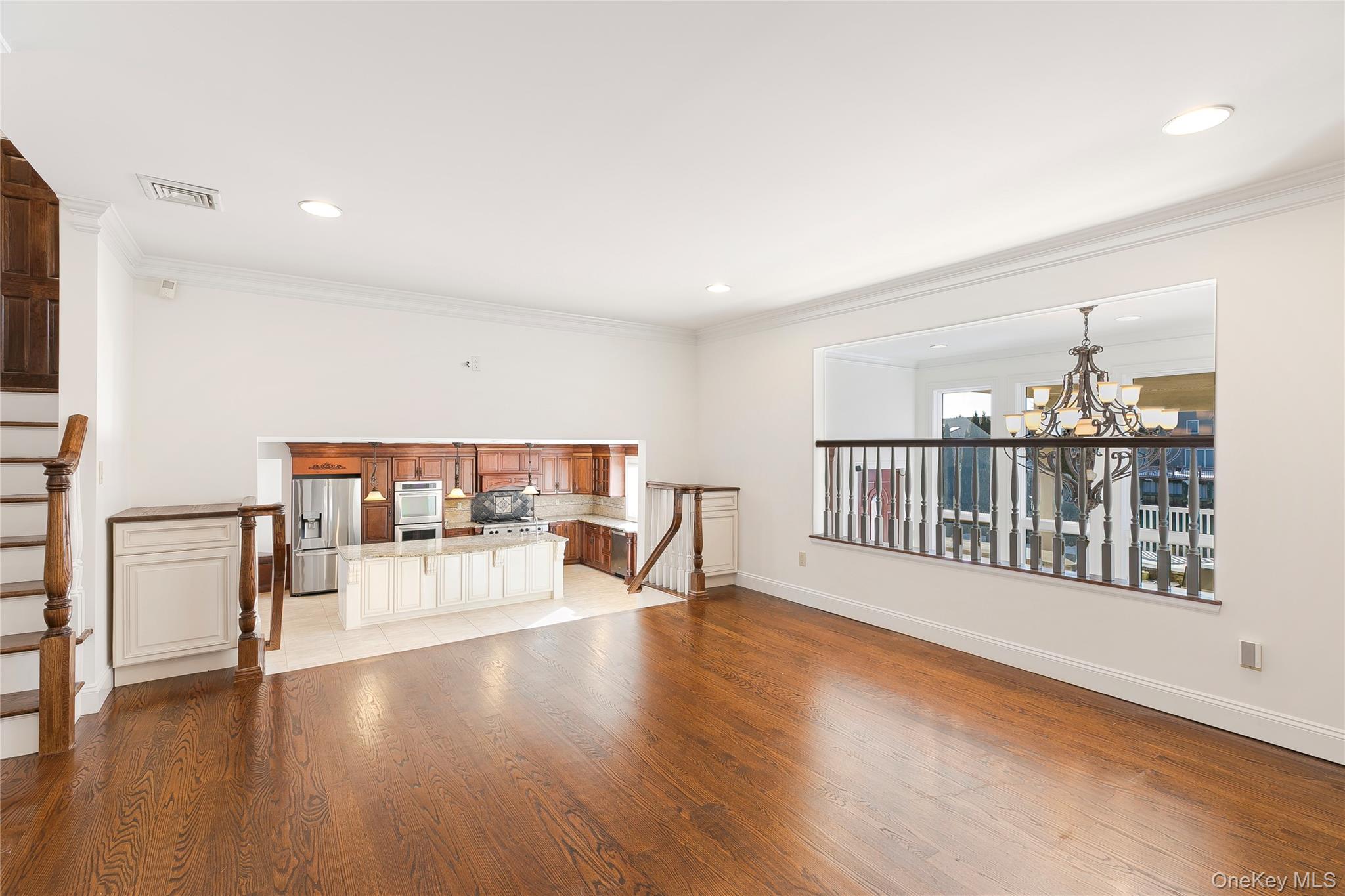2904 Riverside Drive Wantagh, NY 11793 - Photo 11 of 19 a view of a living room and a dining room with wooden floor