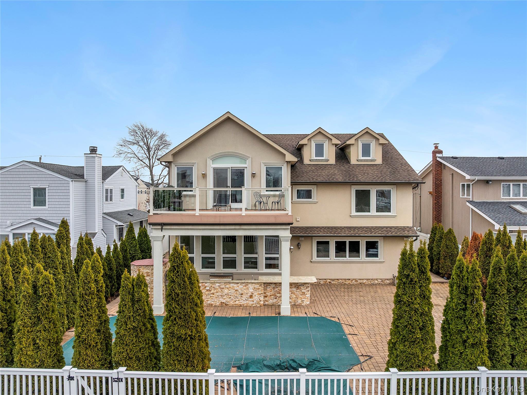 2904 Riverside Drive Wantagh, NY 11793 - Photo 17 of 19 a front view of a house with a garden