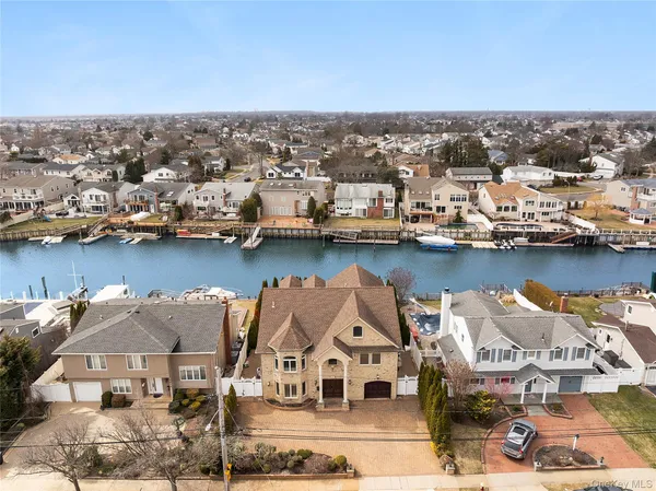 an aerial view of a house with a ocean view