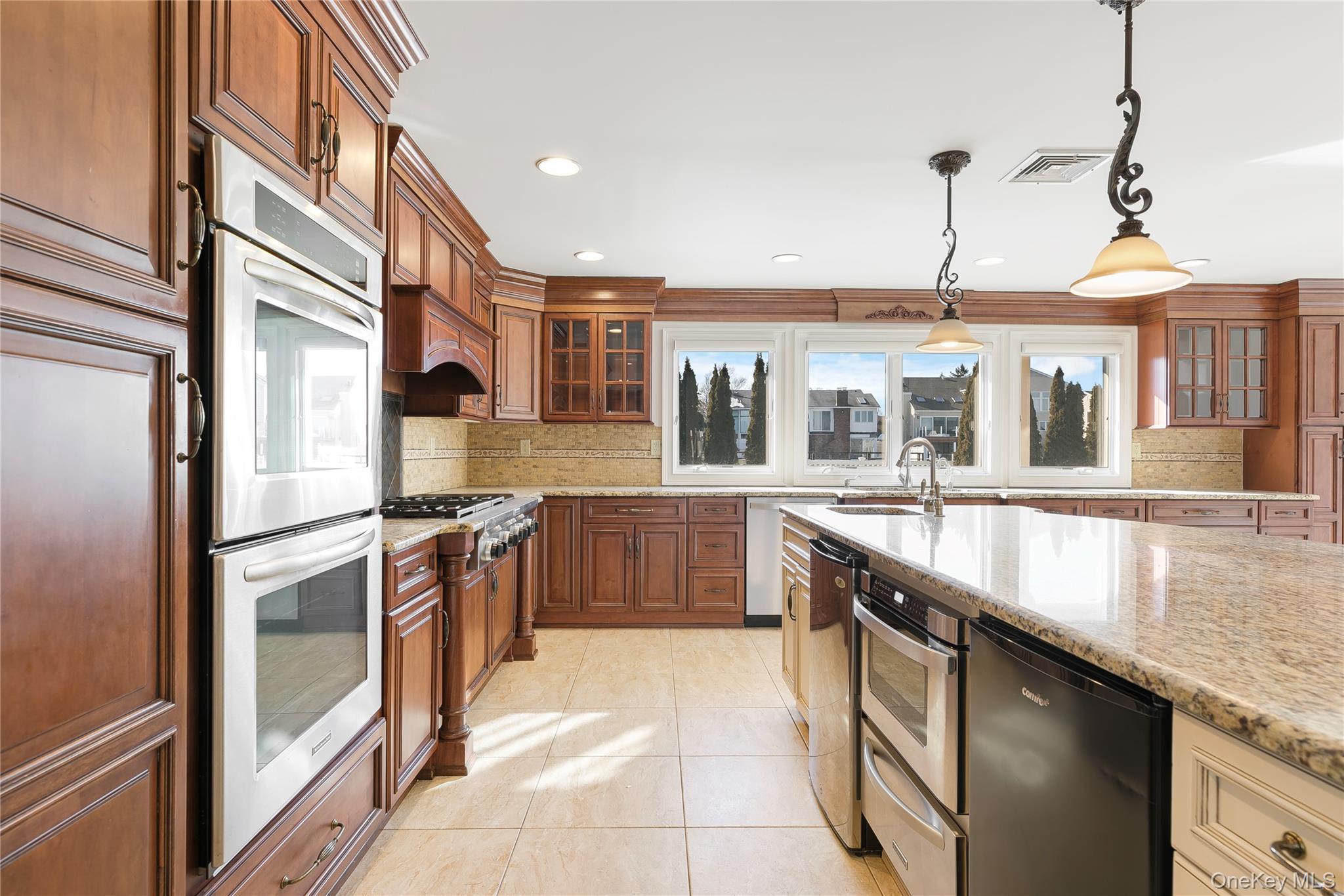 2904 Riverside Drive Wantagh, NY 11793 - Photo 8 of 19 a kitchen with stainless steel appliances granite countertop a sink and a stove