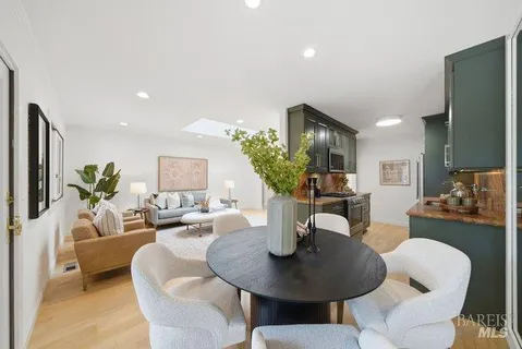 a living room with fireplace furniture and a flat screen tv