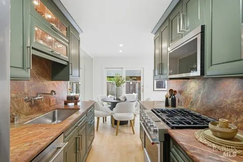 a kitchen with a stove and a sink