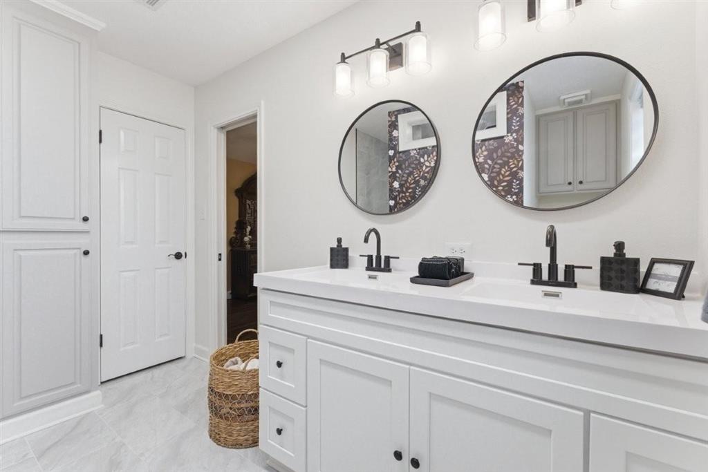 1304 Theriot Road Lake Charles, LA 70611 - Photo 13 of 35 Primary Bathroom: Totally renovated from floor to ceiling;Walk-in shower,walk-in closet,double sinks