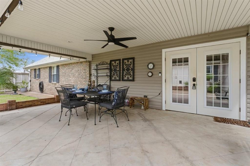 1304 Theriot Road Lake Charles, LA 70611 - Photo 26 of 35 Covered back patio area. Double French doors lead into living area.
