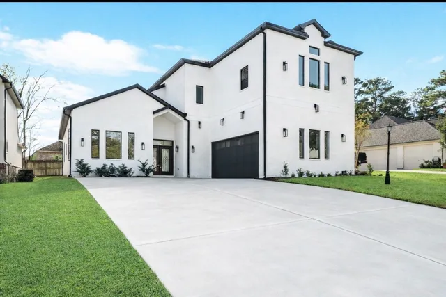 a bedroom with a bed window and couch