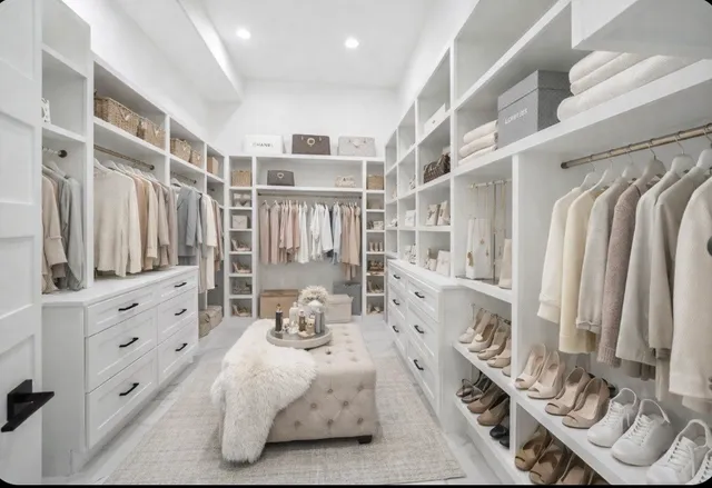 a view of a room with a stylish ceiling fan and entryway