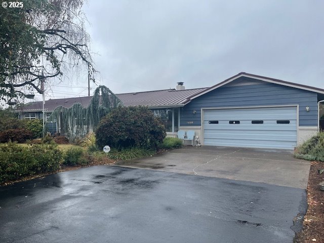 2620 North 23rd Street Springfield, OR 97477 - Photo 1 of 24 a front view of a house with a yard and garage