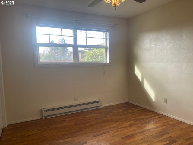 2620 North 23rd Street Springfield, OR 97477 - Photo 14 of 24 an empty room with wooden floor and windows