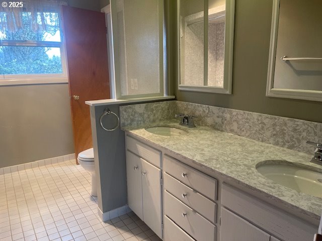2620 North 23rd Street Springfield, OR 97477 - Photo 15 of 24 a bathroom with a granite countertop sink and a mirror
