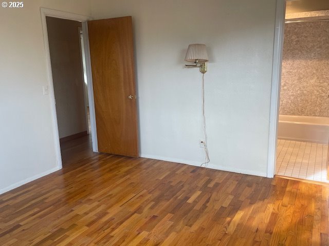 2620 North 23rd Street Springfield, OR 97477 - Photo 18 of 24 a view of an empty room with wooden floor and a window