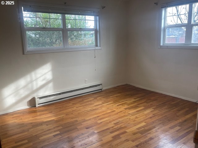 2620 North 23rd Street Springfield, OR 97477 - Photo 19 of 24 an empty room with wooden floor and windows