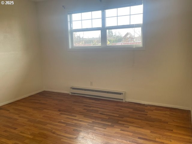 2620 North 23rd Street Springfield, OR 97477 - Photo 20 of 24 an empty room with wooden floor and windows