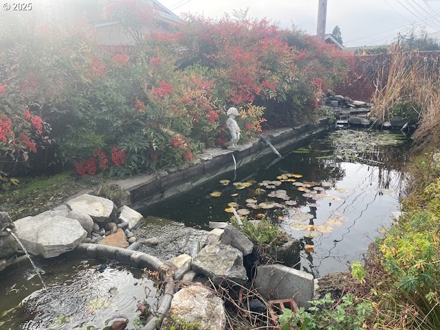 2620 North 23rd Street Springfield, OR 97477 - Photo 5 of 24 a view of a fire pit with a yard