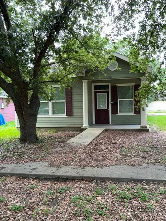 a house with trees in front of it