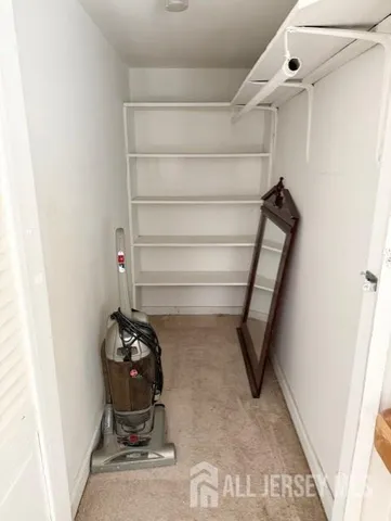 a view of entryway with air conditioner and window