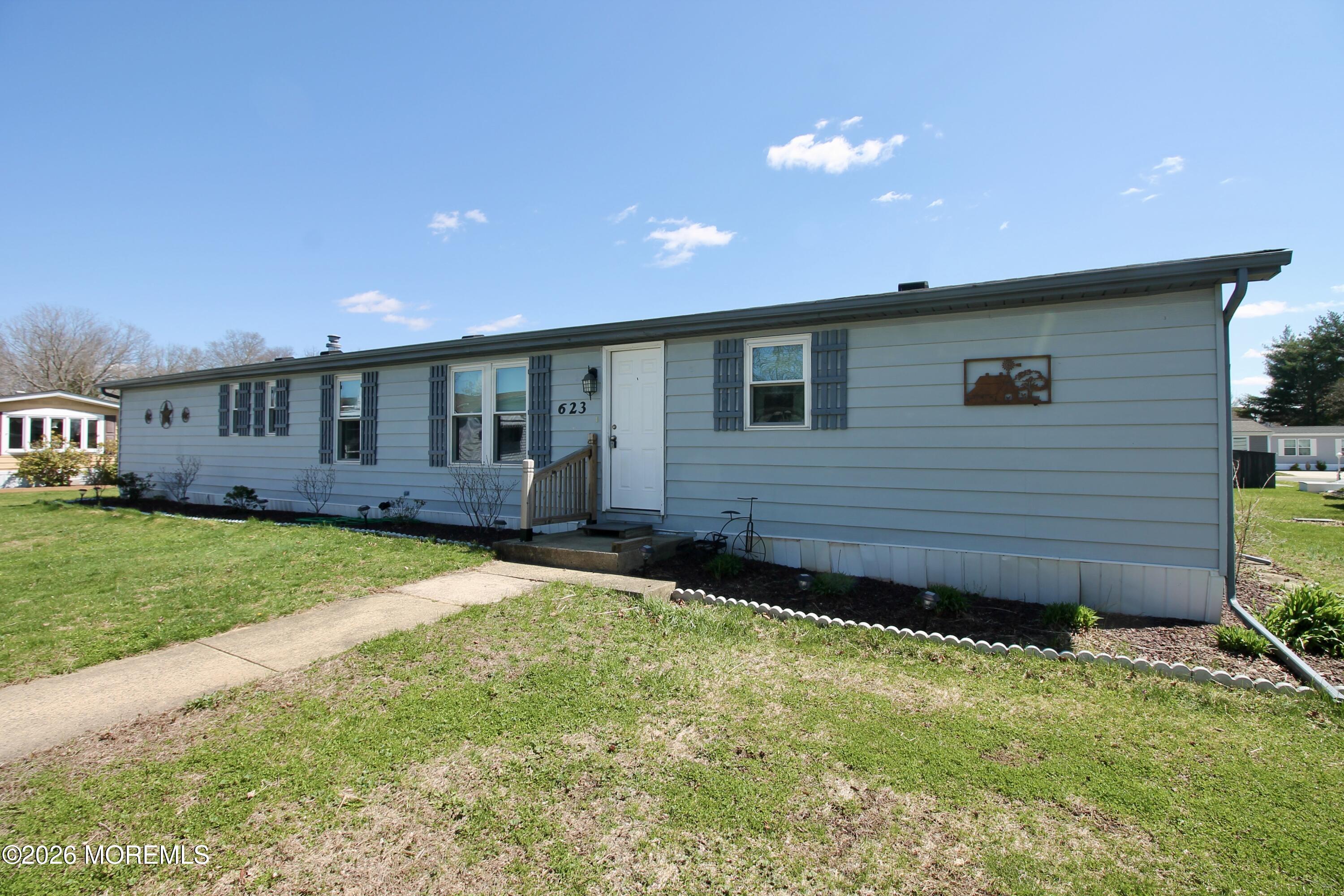 623 Sara Drive Freehold, NJ 07728 - Photo 1 of 28 a view of an house with backyard space and balcony