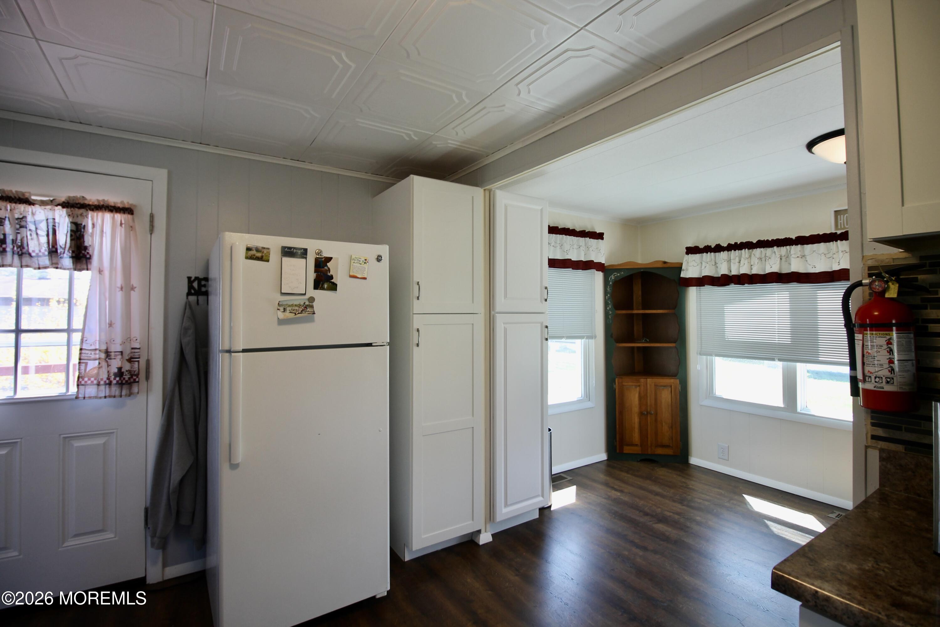 623 Sara Drive Freehold, NJ 07728 - Photo 12 of 28 a view of empty room with wooden floor and window