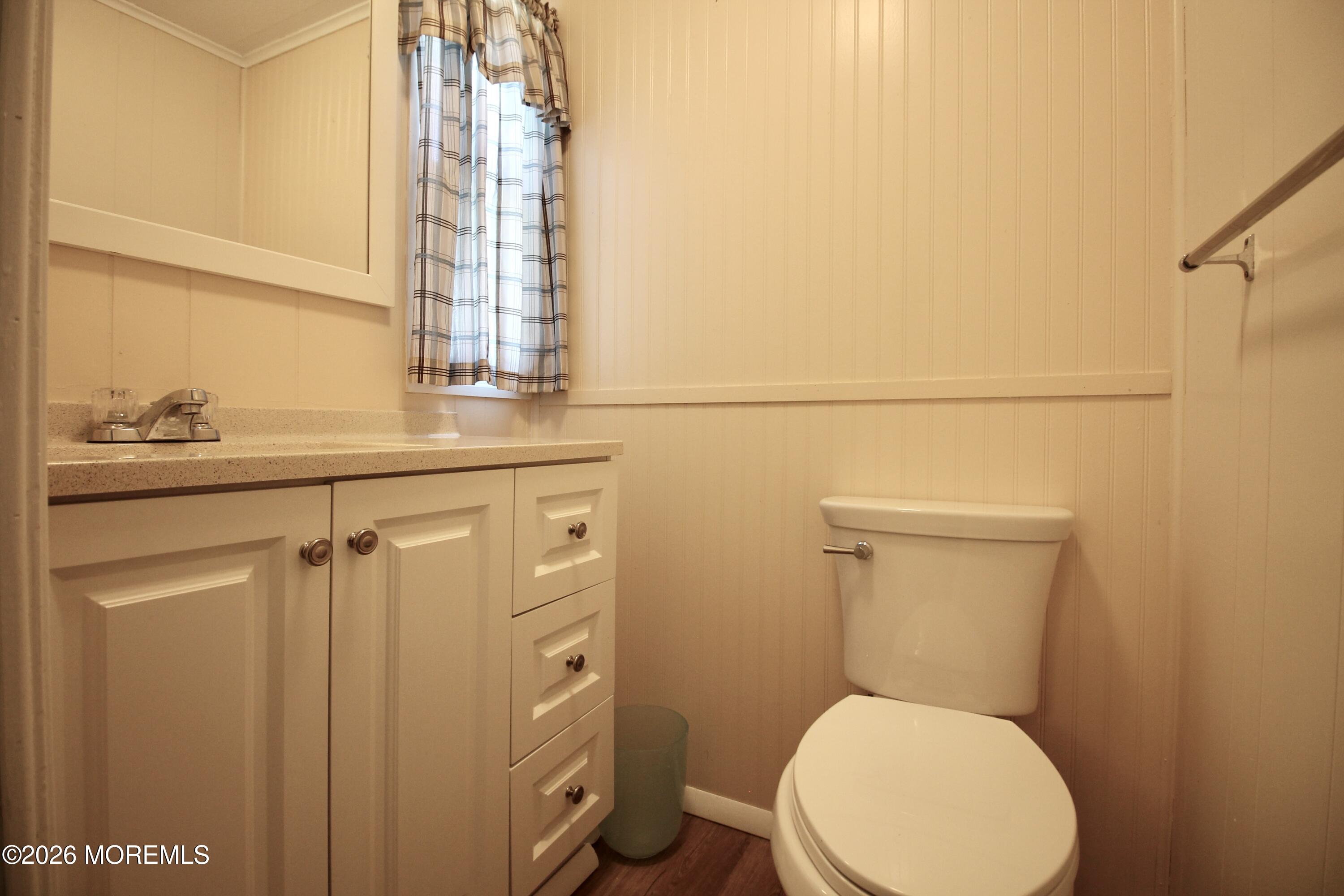 623 Sara Drive Freehold, NJ 07728 - Photo 16 of 28 a bathroom with a toilet a sink and mirror
