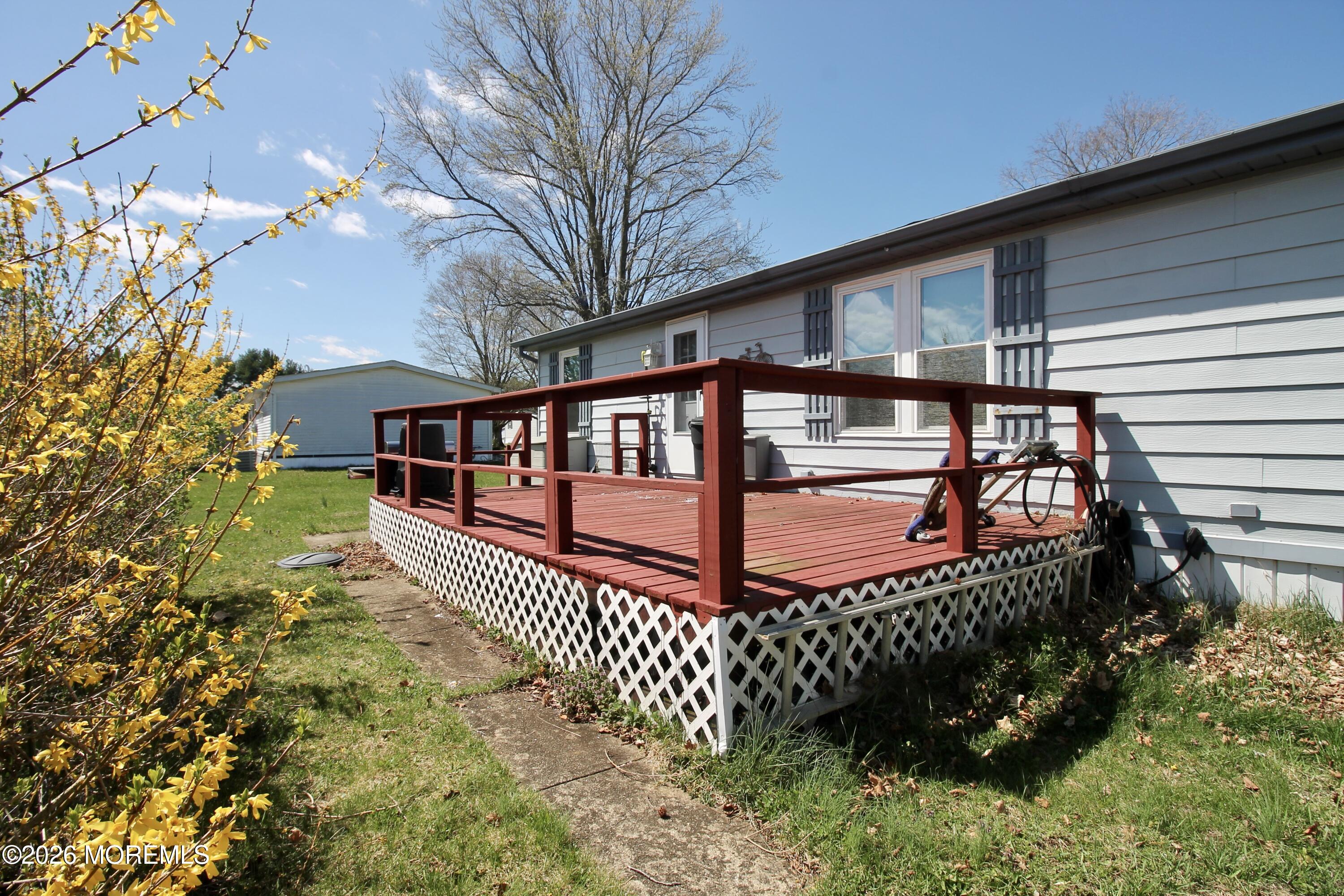 623 Sara Drive Freehold, NJ 07728 - Photo 26 of 28 a view of a porch with a bench