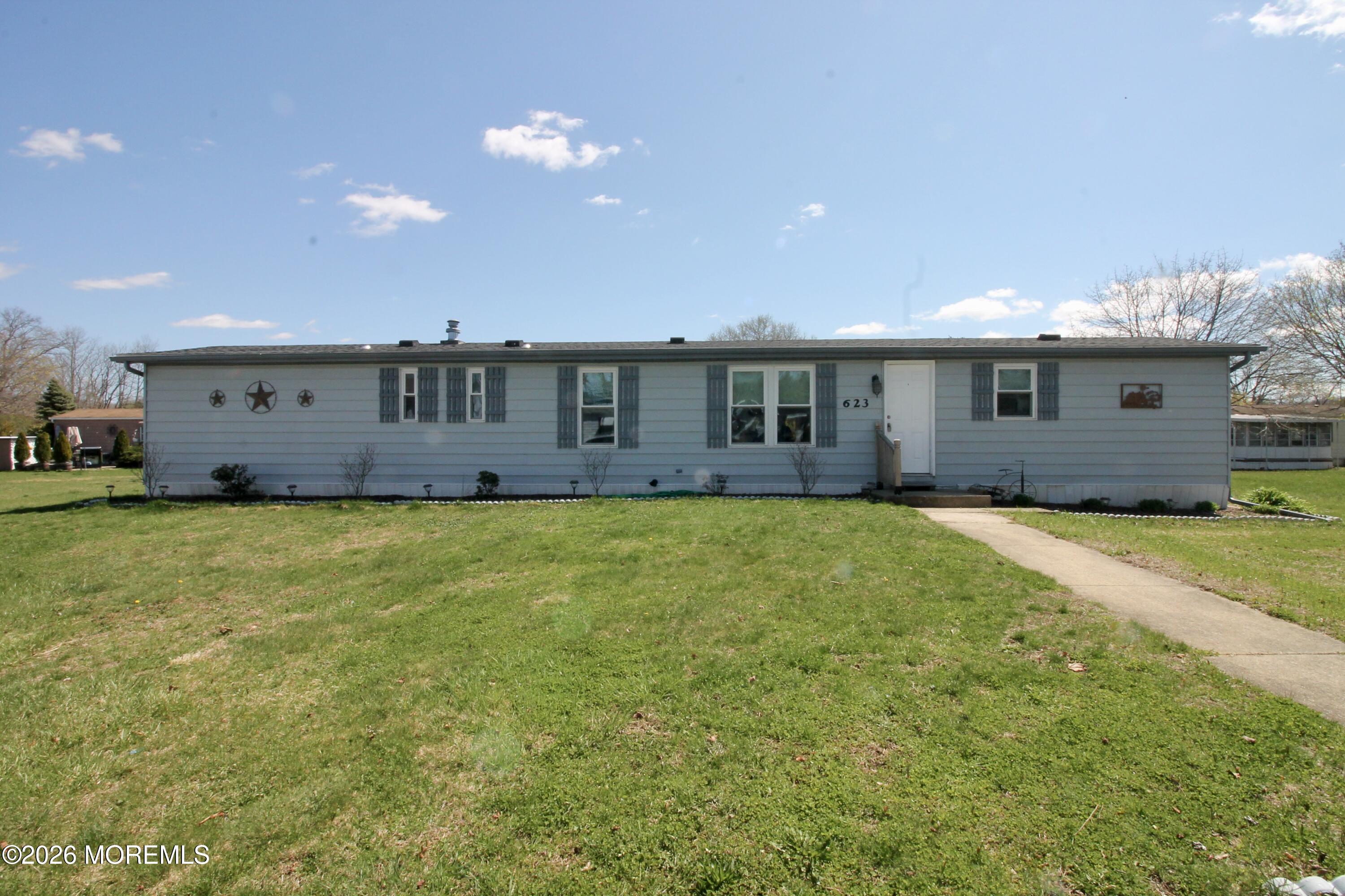 623 Sara Drive Freehold, NJ 07728 - Photo 3 of 28 a front view of house with yard space and balcony