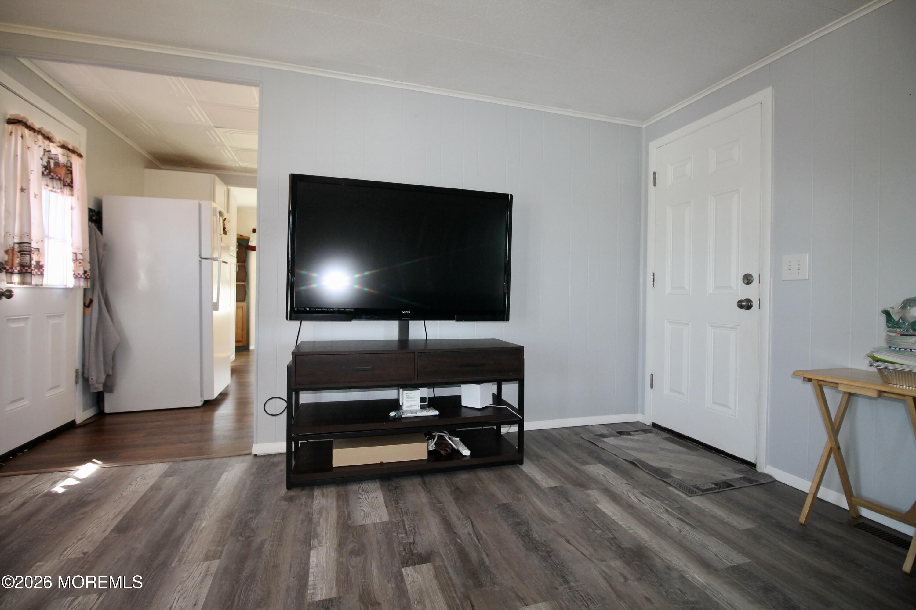623 Sara Drive Freehold, NJ 07728 - Photo 7 of 28 a living room with furniture and a flat screen tv