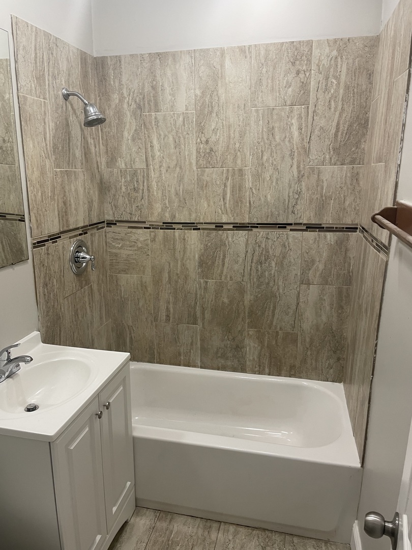 5145 South Lowe Avenue Chicago, IL 60609 - Photo 11 of 17 a bathroom with a sink and a bathtub