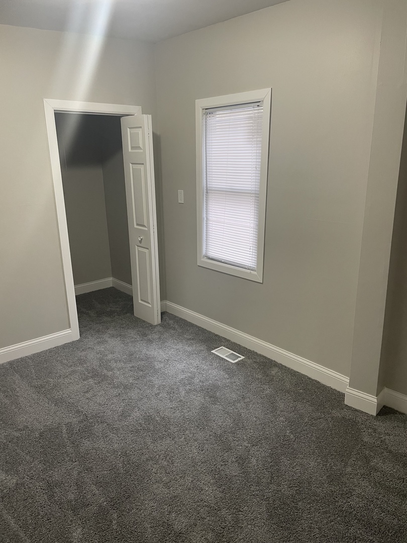 5145 South Lowe Avenue Chicago, IL 60609 - Photo 10 of 17 an empty room with windows and closet