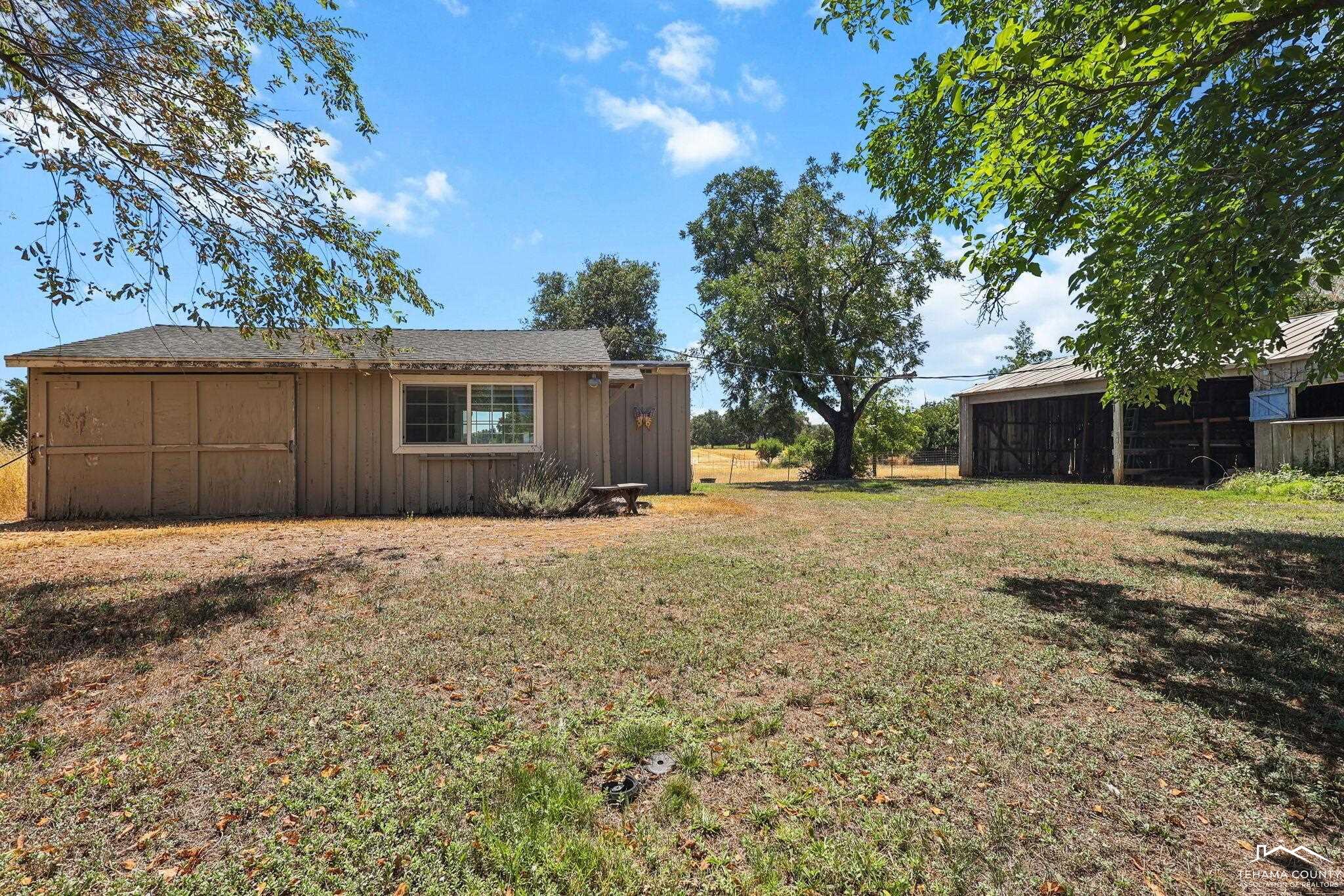 22275 Brent Road Red Bluff, CA 96080 - Photo 39 of 47 a house with trees in front of it