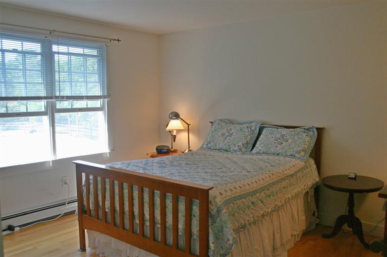 60 Slough Road Brewster, MA 02631 - Photo 14 of 22 a bedroom with a bed and window