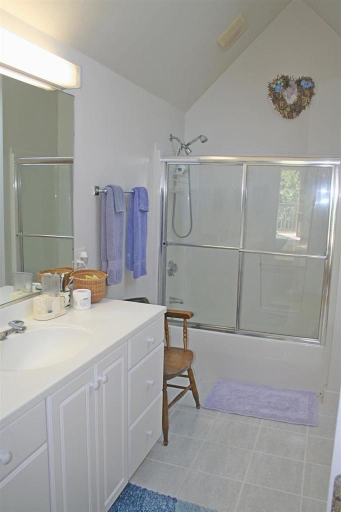 60 Slough Road Brewster, MA 02631 - Photo 17 of 22 a bathroom with a sink a toilet and shower