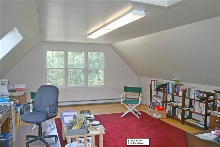 60 Slough Road Brewster, MA 02631 - Photo 18 of 22 a view of a workspace with furniture and a window