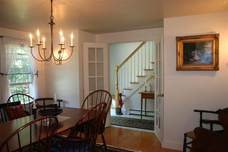 60 Slough Road Brewster, MA 02631 - Photo 3 of 22 a view of a livingroom with furniture entryway and wooden floor