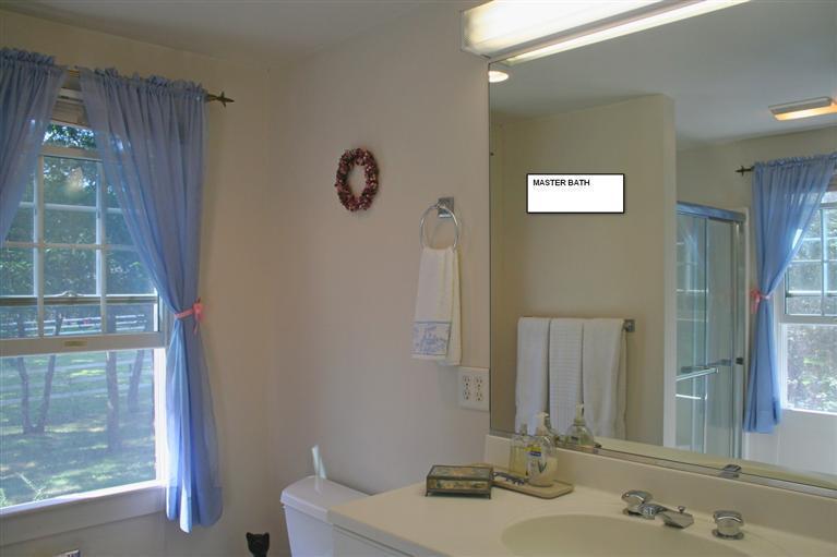 60 Slough Road Brewster, MA 02631 - Photo 9 of 22 a bathroom with a sink and a mirror