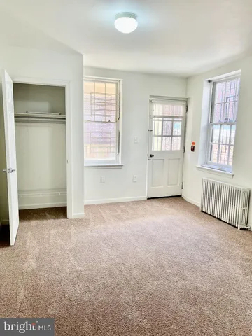 a front view of a building with glass windows