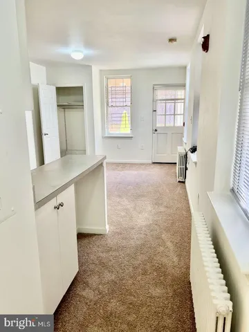 a big room with closet and windows