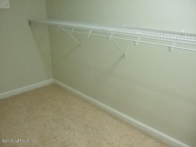 7002 Roundleaf Drive Jacksonville, FL 32258 - Photo 13 of 13 a view of a room with racks on the wall