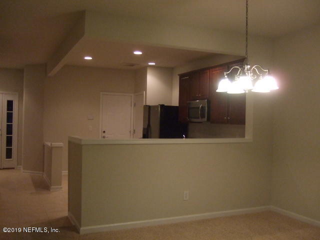 7002 Roundleaf Drive Jacksonville, FL 32258 - Photo 6 of 13 a view of a livingroom with furniture and a chandelier