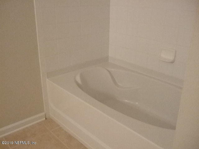 7002 Roundleaf Drive Jacksonville, FL 32258 - Photo 7 of 13 a close up of a bathtub