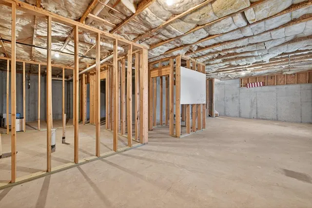 a view of a room with wooden walls