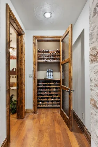 a living room with fireplace furniture and a large window