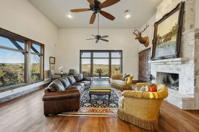 a living room with furniture and a fireplace